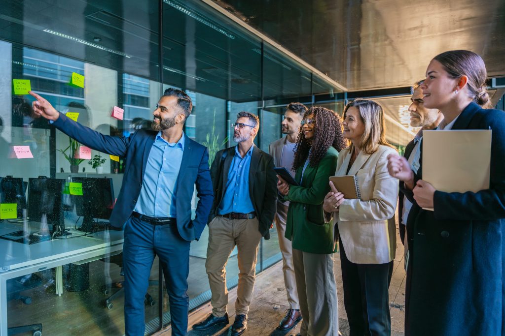 Team of Professionals Brainstorming with Sticky Notes in Modern Office